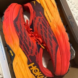Hoka Orange and Red Sneakers. Speedgoat 5.